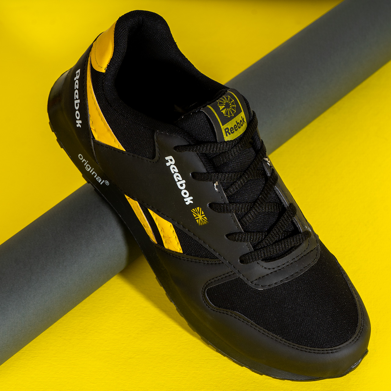 کفش ورزشی Reebok مشکی زرد مردانه مدلRako