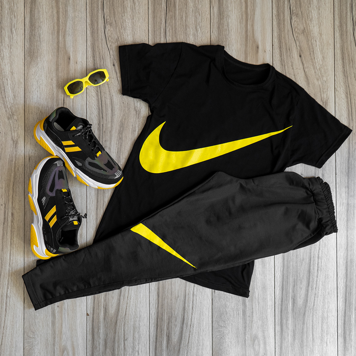 ست تیشرت شلوار نایک مشکی زرد مردانه مدل Baren